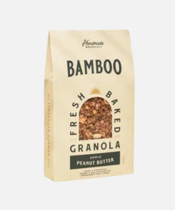 Handmade granola featuring perfectly caramelized Belgian and French oats, enhanced with Canadian maple syrup, puffed quinoa, dried apple, and a touch of Fleur de Sel de Guérande. Enjoy a delicious blend of creamy peanut butter and fresh apple - a tasty, crusty, and healthy alternative to regular snacks.