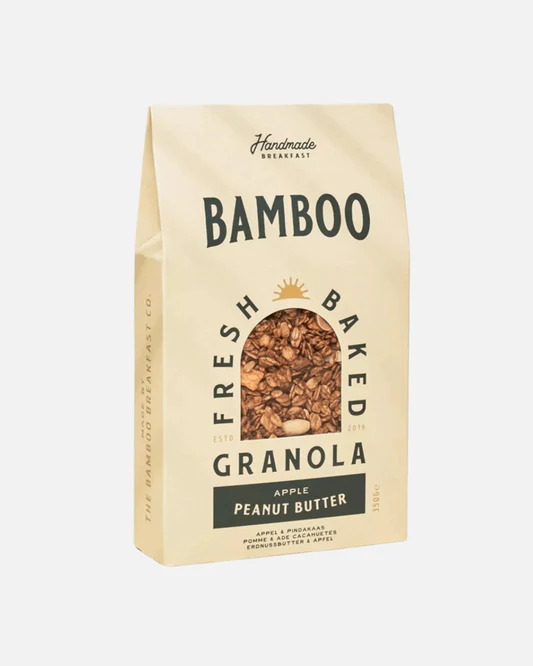Handmade granola featuring perfectly caramelized Belgian and French oats, enhanced with Canadian maple syrup, puffed quinoa, dried apple, and a touch of Fleur de Sel de Guérande. Enjoy a delicious blend of creamy peanut butter and fresh apple - a tasty, crusty, and healthy alternative to regular snacks.